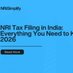 NRI reviewing Indian tax forms and ITR documents on a laptop